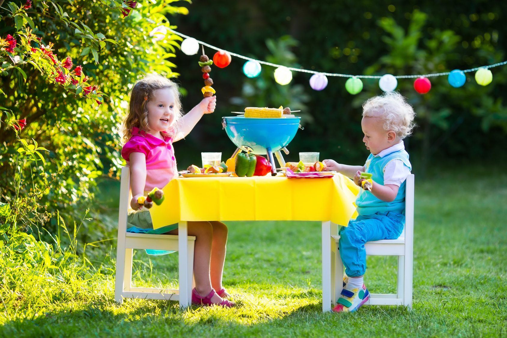 Kids play at a table outside
