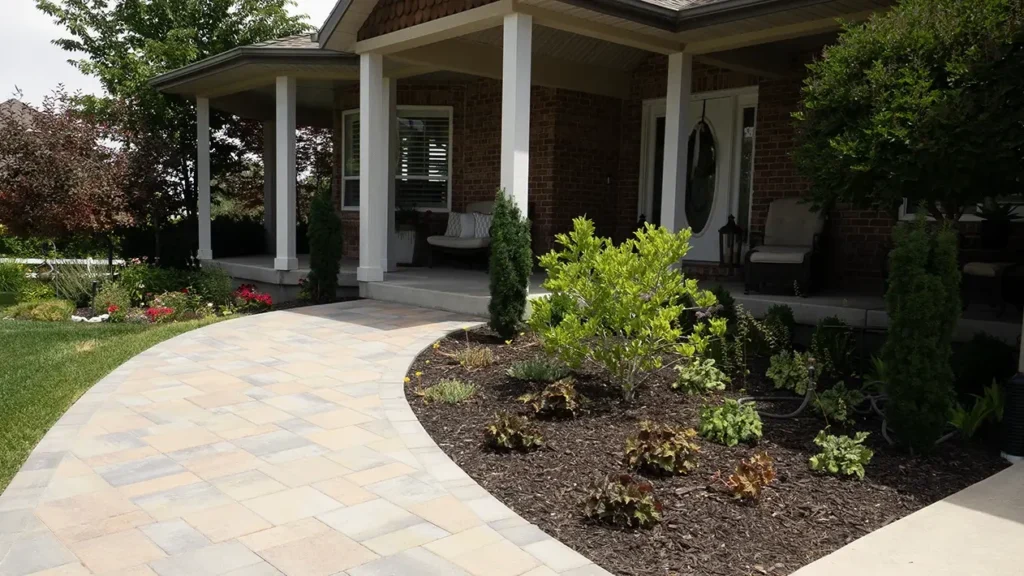 paver sidewalk with mulched flowerbed