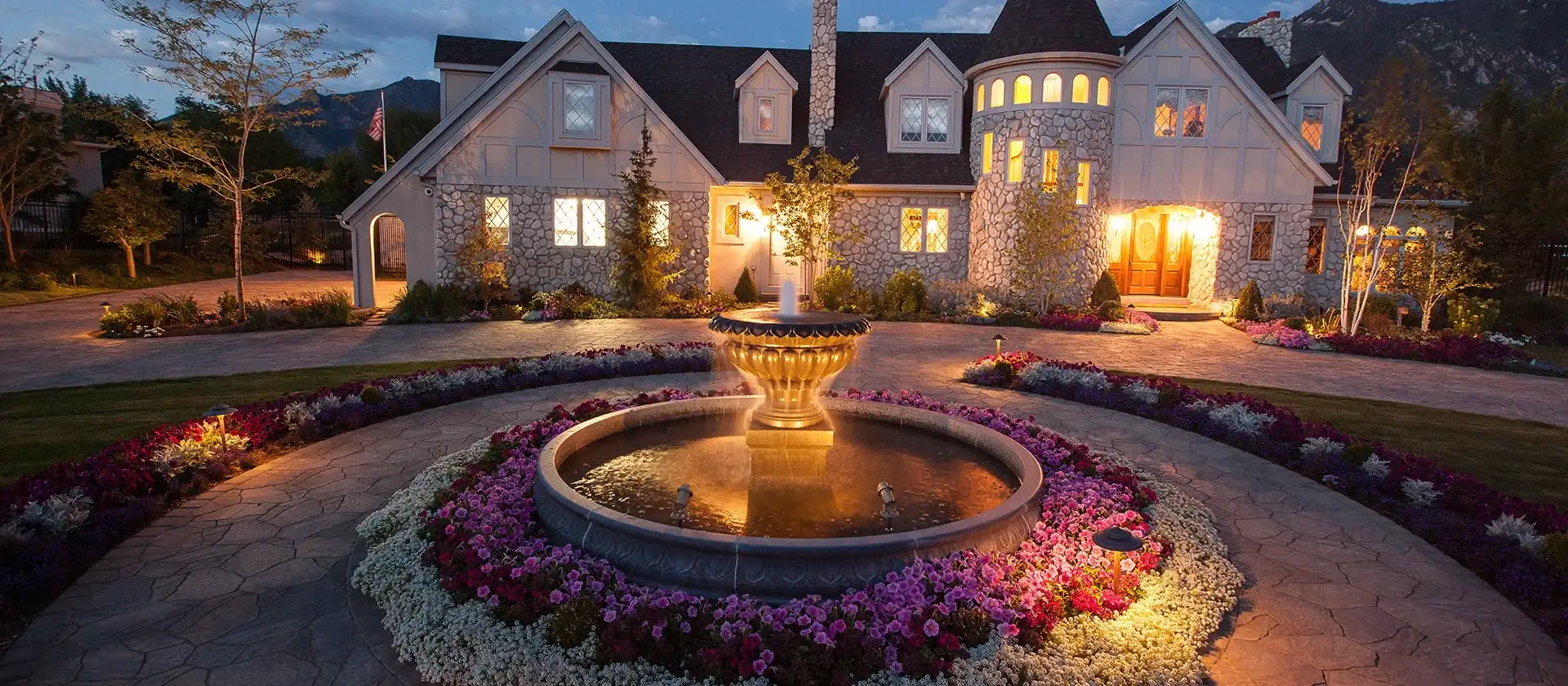 a water feature is surrounded by a circular driveway