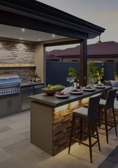 Photo of a high end outdoor kitchen with under counter lighting